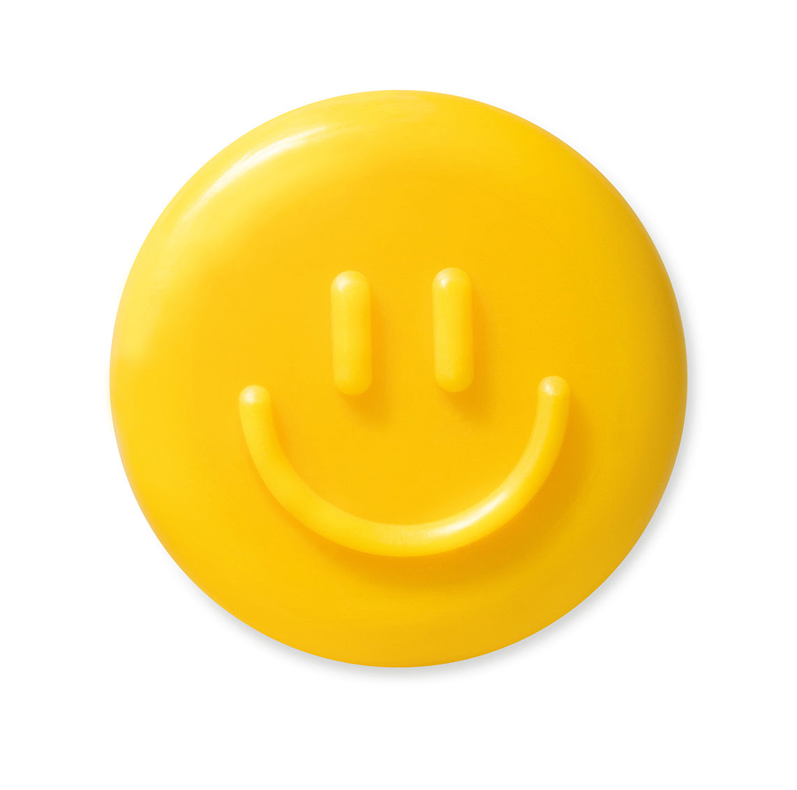 Runde, gelbe Seife in Form eines lächelnden Smileys