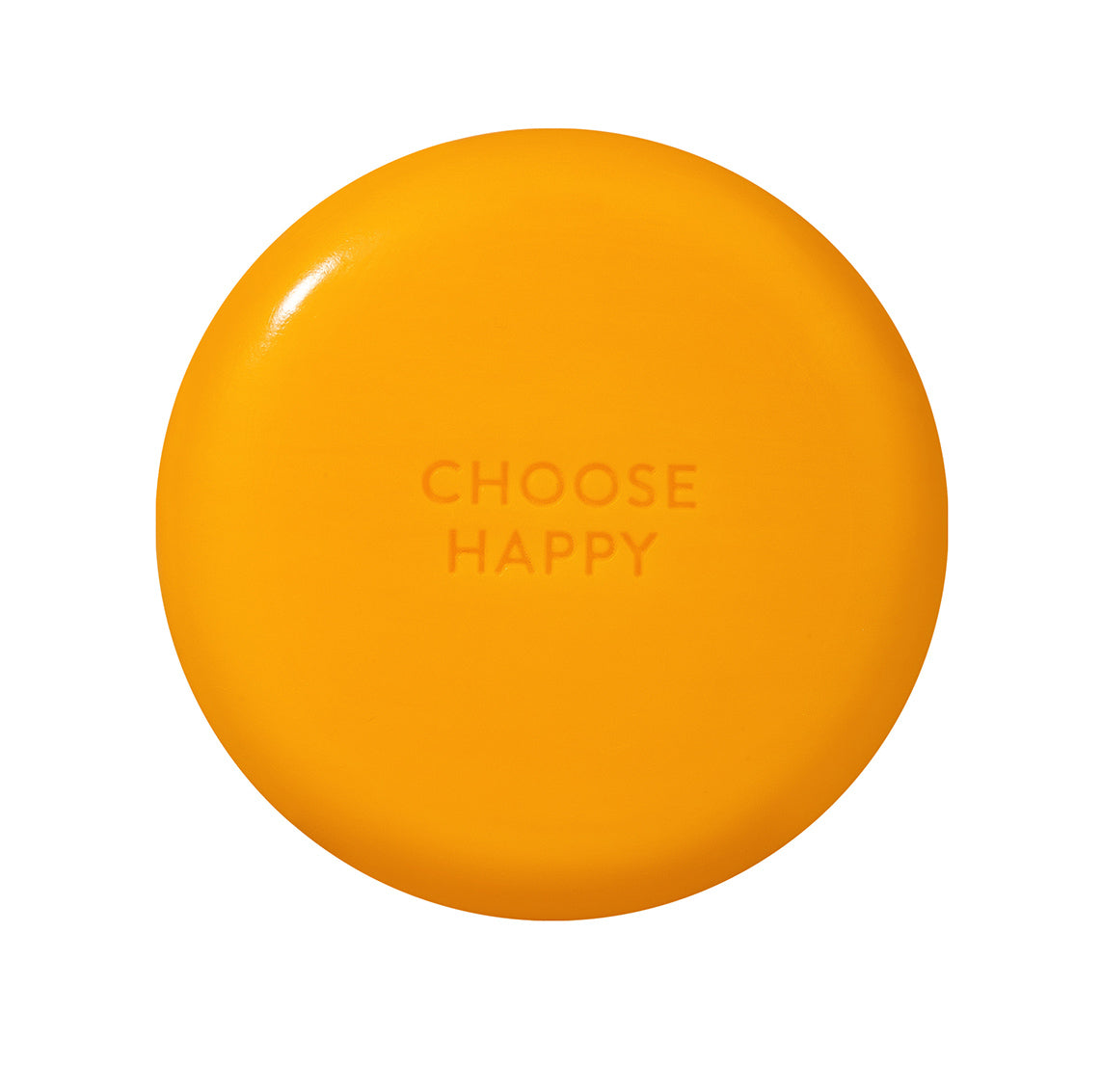 Auf der Rückseite der runden, orangefarbenen Smiley-Seife steht "choose happy"