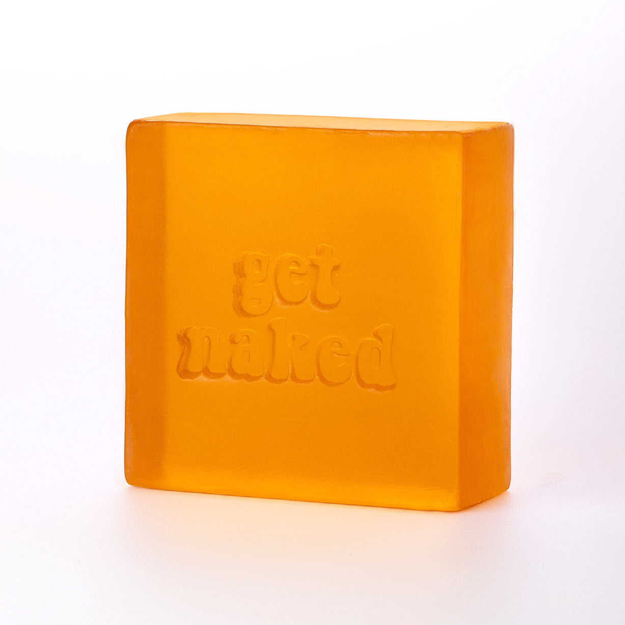 quadratische transparente Glycerinseife in orange mit einer Stempelung "get naked"