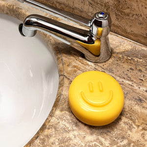 Feste Seife gelb mit Smiley-Gesicht, rund