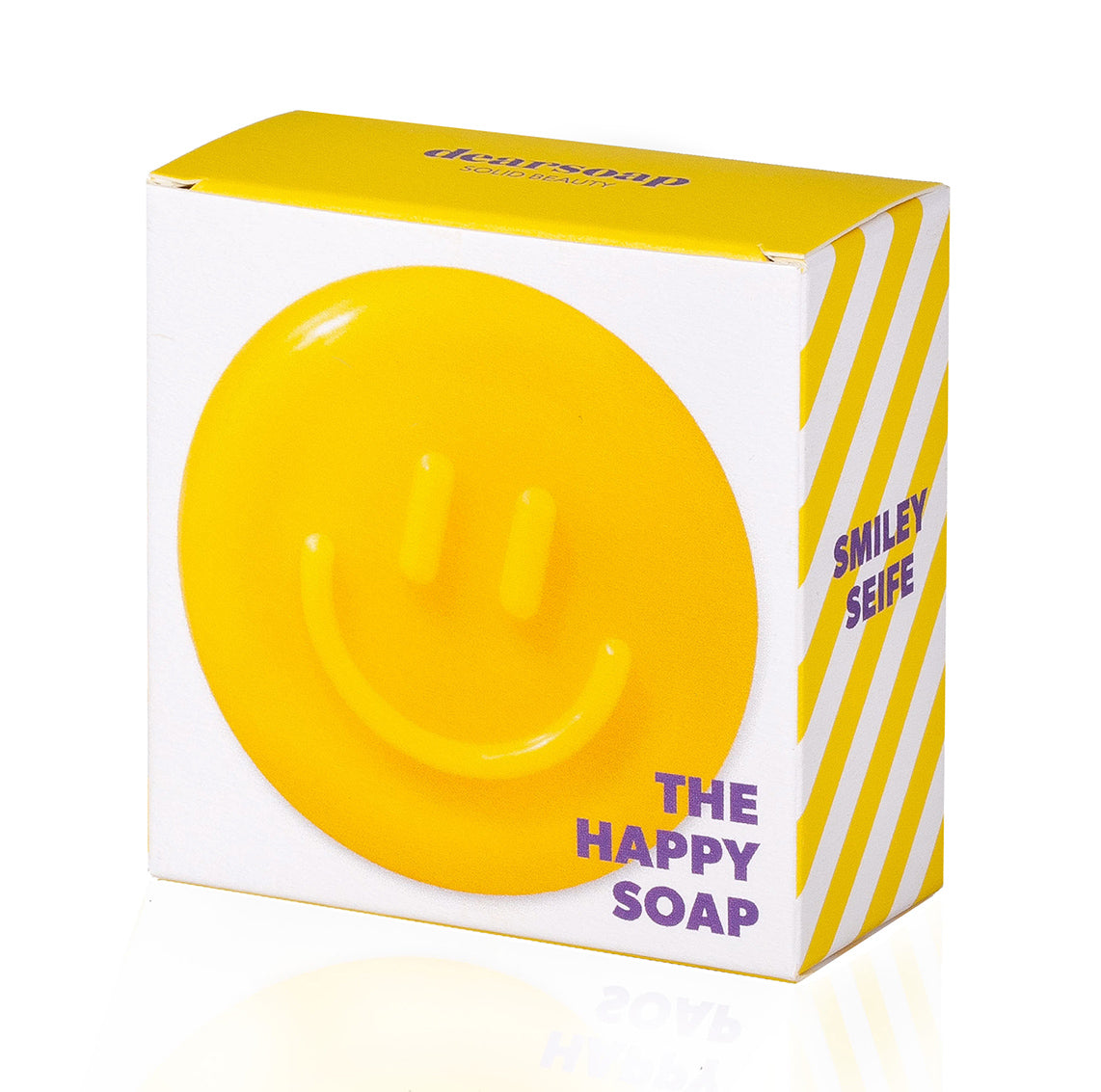 Die Verpackung der gelben Smiley-Seife zeigt die Seife selbst mit dem Zusatz "The Happy Soap"